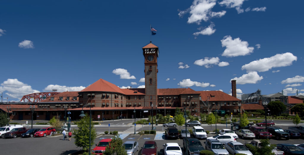 Union Station in Portland, showing the large tower with the words Go By Train printed on the top of the tower.