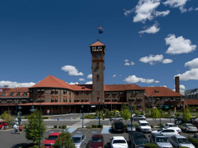 Union Station in Portland, showing the large tower with the words Go By Train printed on the top of the tower.
