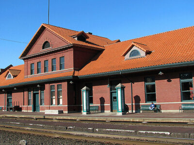 The outside of the Centralia Station highlighting the brick walls and red Spanish tile roof.