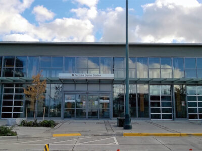 The front wall of the Tacoma Dome Station, which is made mostly of windows.