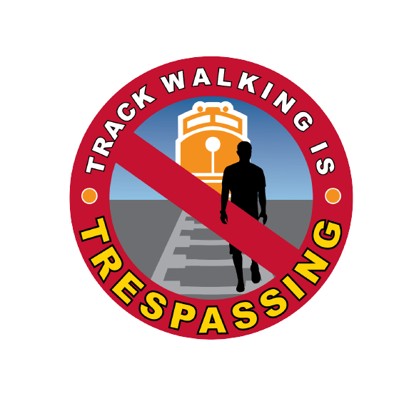 Graphic shows a red slash across an outline of a person walking on train tracks. Text says "Track walking is trespassing."
