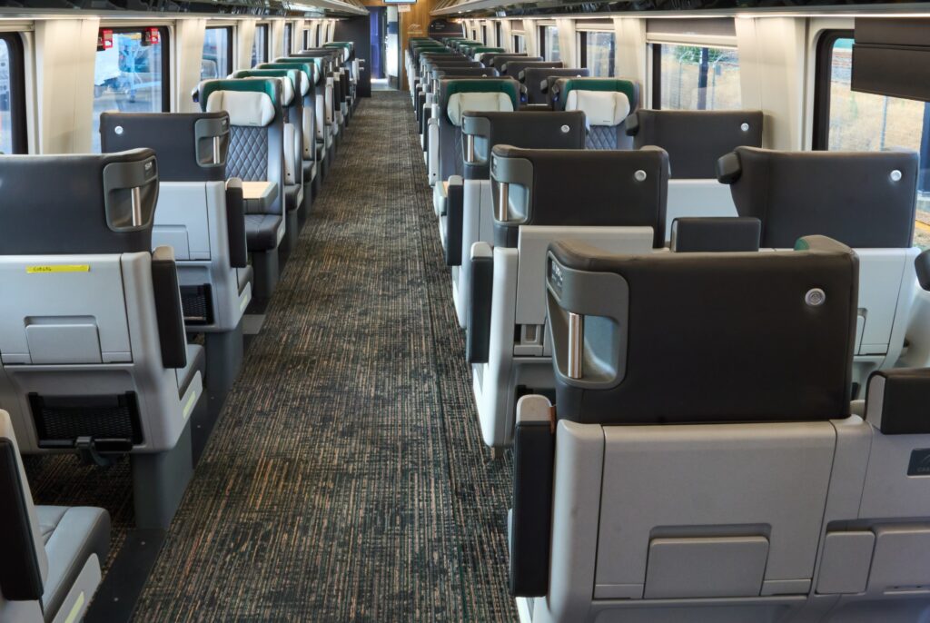 Photo taken inside a new Amtrak Cascades Business Car showing table seating before it leaves the factory for testing.