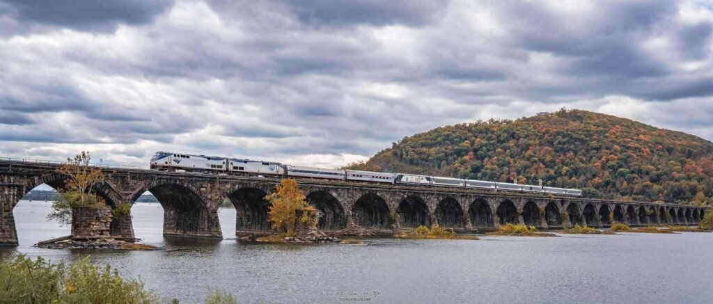 Photo of the New Amtrak Cascades Trainset #1 being pulled to Philly for the next round of testing. In this image, the train is almost to Philly. This is the Rockville Bridge in Harrisburg, PA, as captured by Carl Zhu. Thank you Carl!