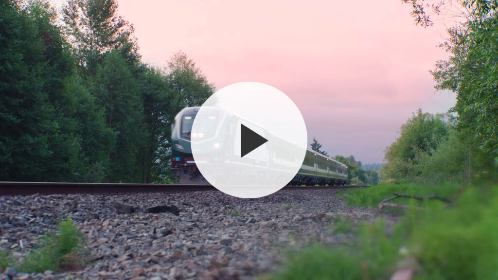 Wathc a new Amtrak Cascades train head north out of the Puyallup valley